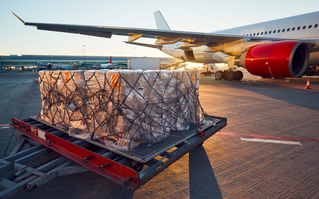 Cargo loader at an airport apron loading freight onto an aircraft