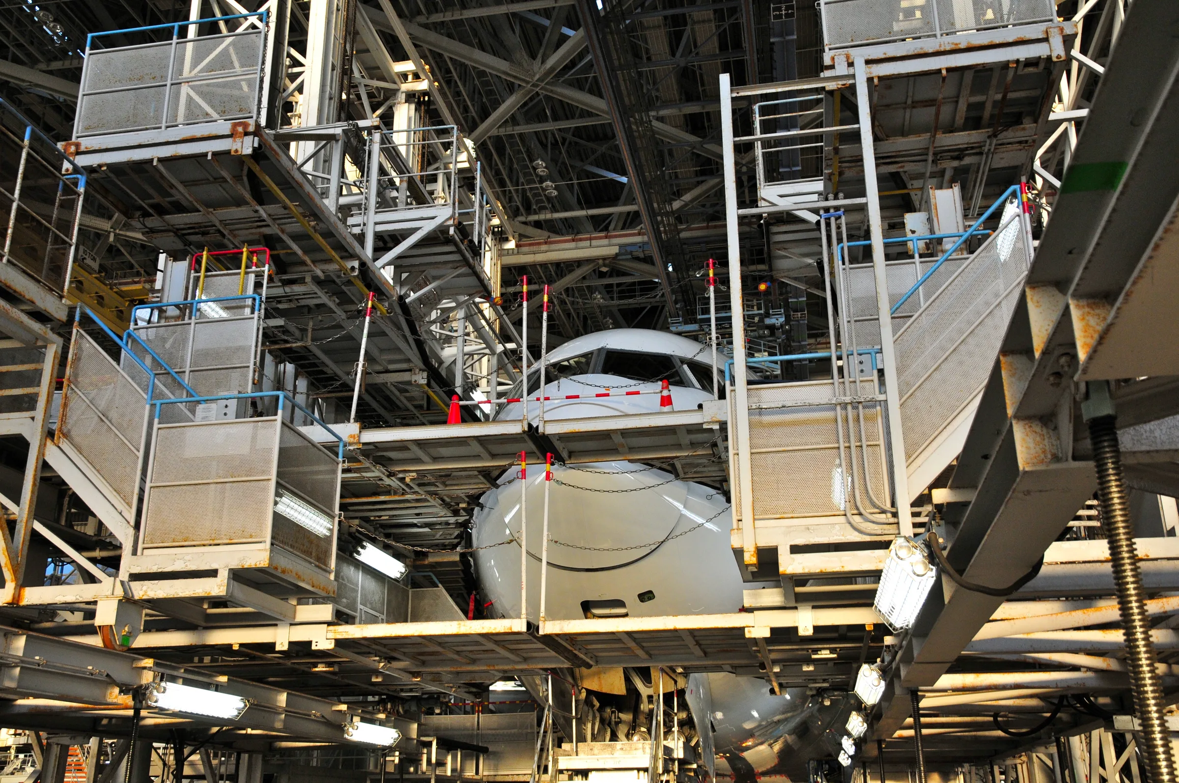 Aircraft undergoing line maintenance in a hangar