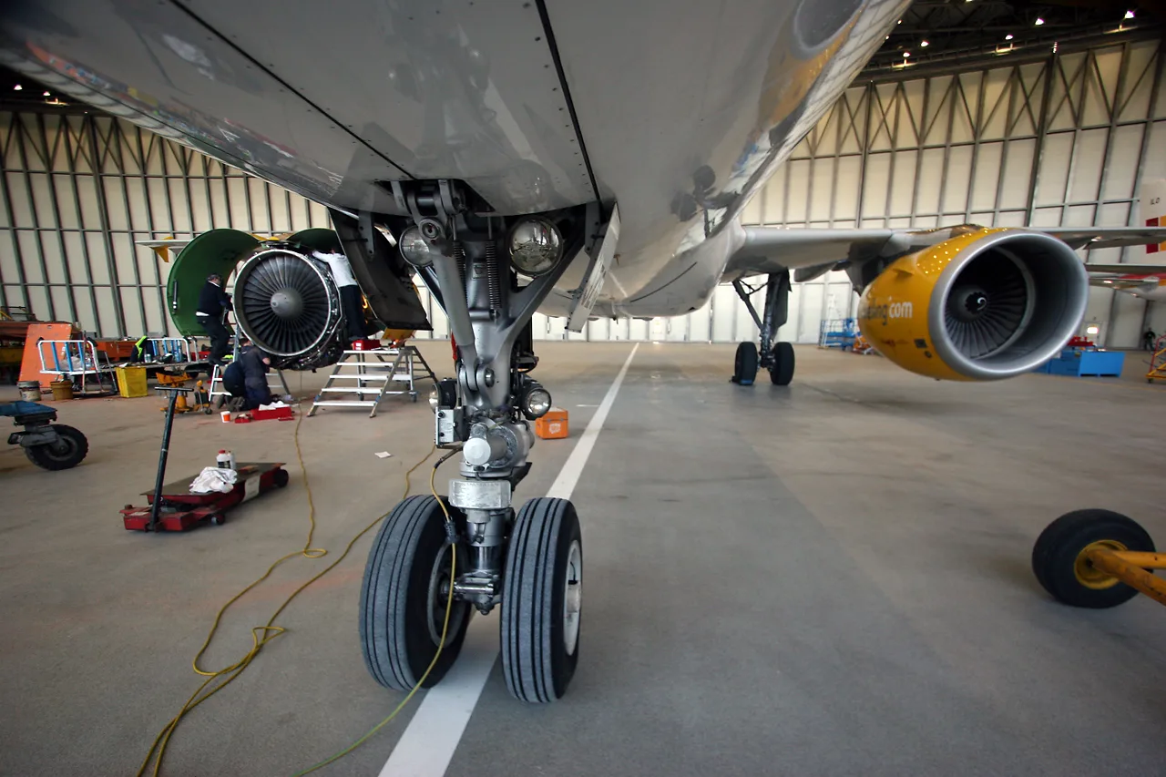 Technician performing aircraft line maintenance