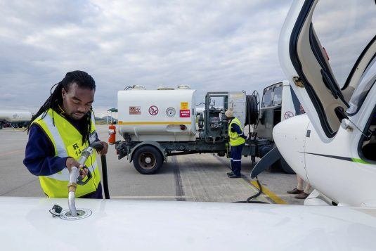 Ground crew fuelling an aircraft